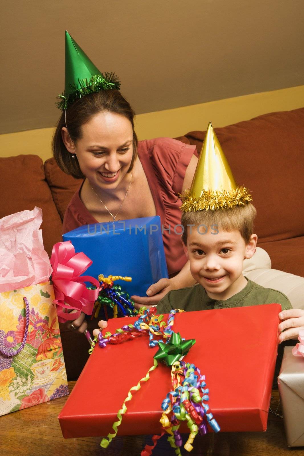 Caucasian mother and son celebrating a birthday party.