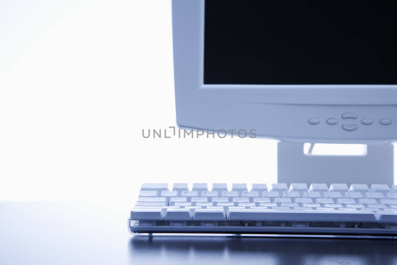 Still life of computer monitor and keyboard.