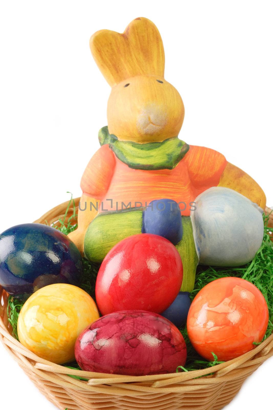 Colorful easter basket with bunny on bright background