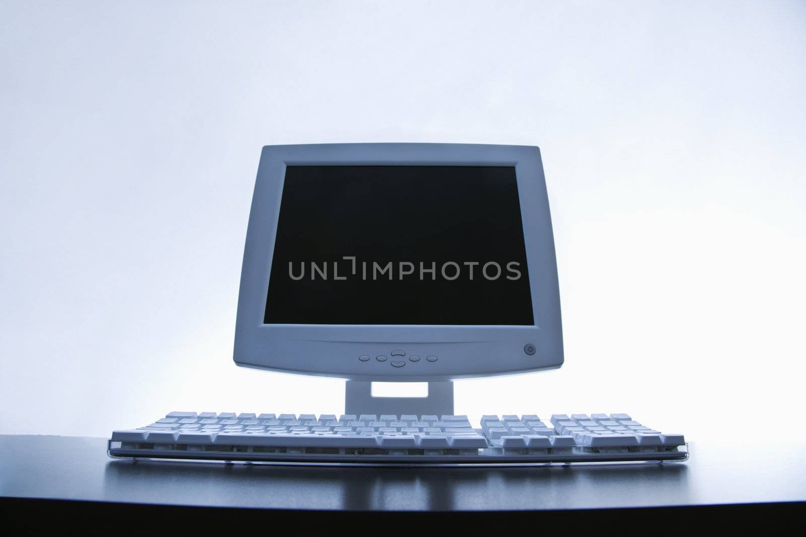 Still life of computer monitor and keyboard.