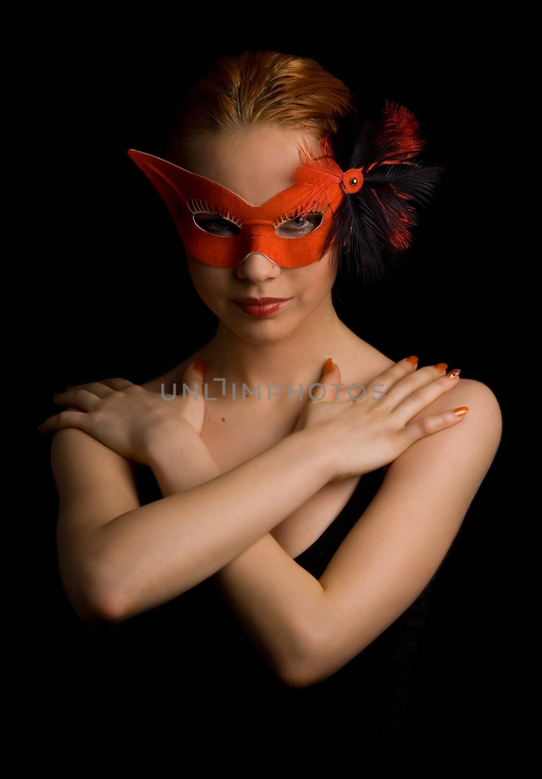 mysterious lady in red mask holding her arms in w shape