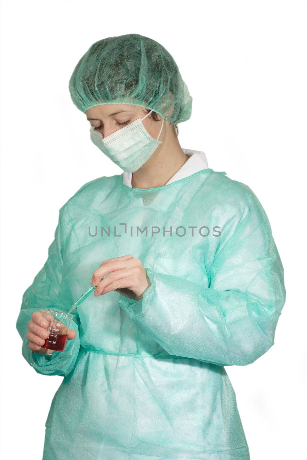 Young female medic with surgical mask - isolated on white