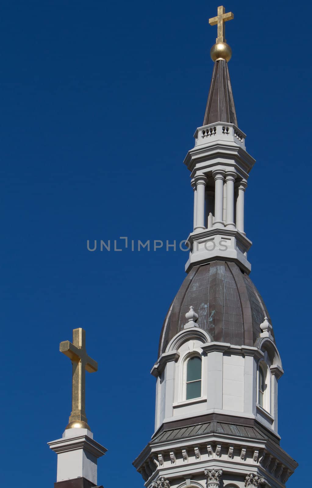 Two Gold Crosses of Cathedral with deep blue sky