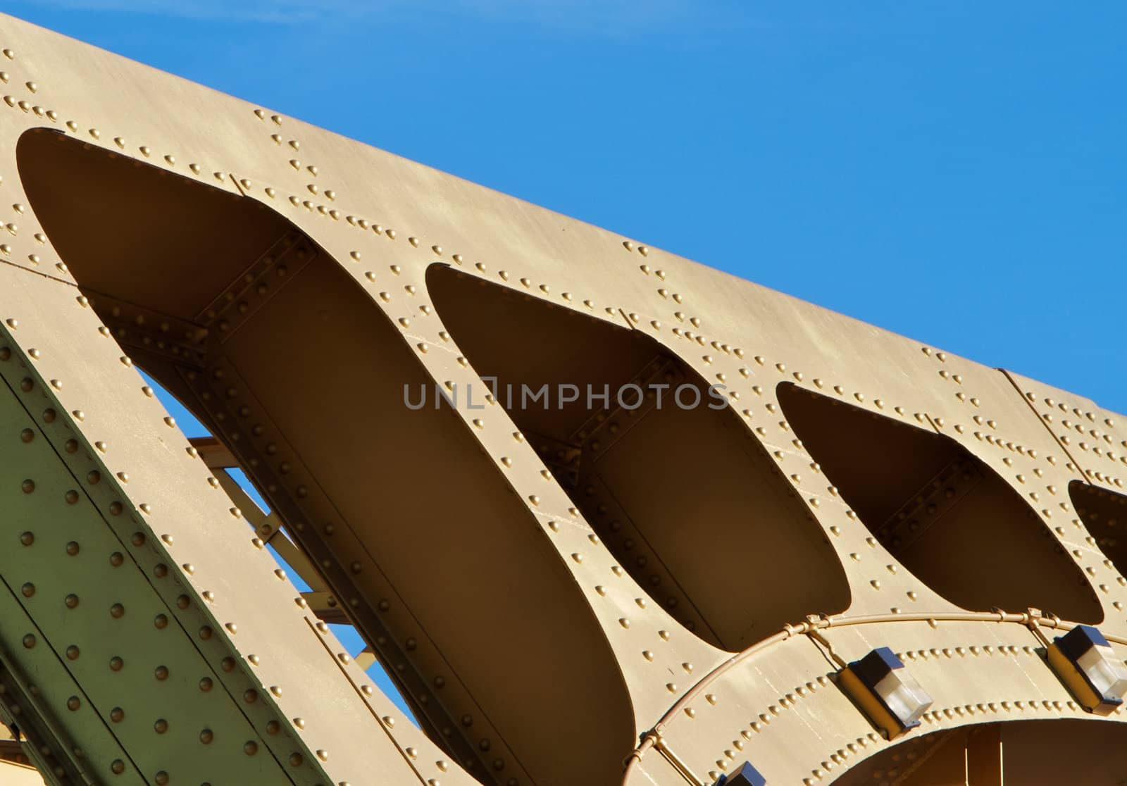 Old style Gold painted steel beam and girders in an abstract view of Sacramento Tower Bridge