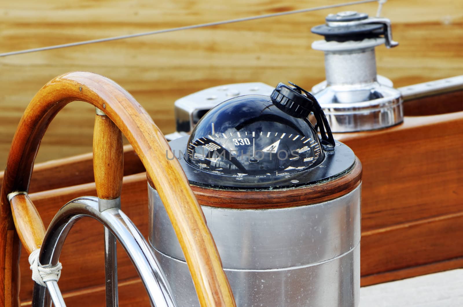 Detail of rudder and compass on a wooden sailboat