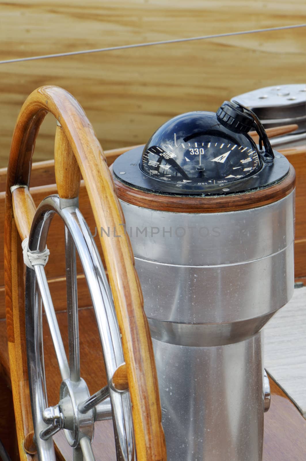 Detail of rudder and compass on a wooden sailboat