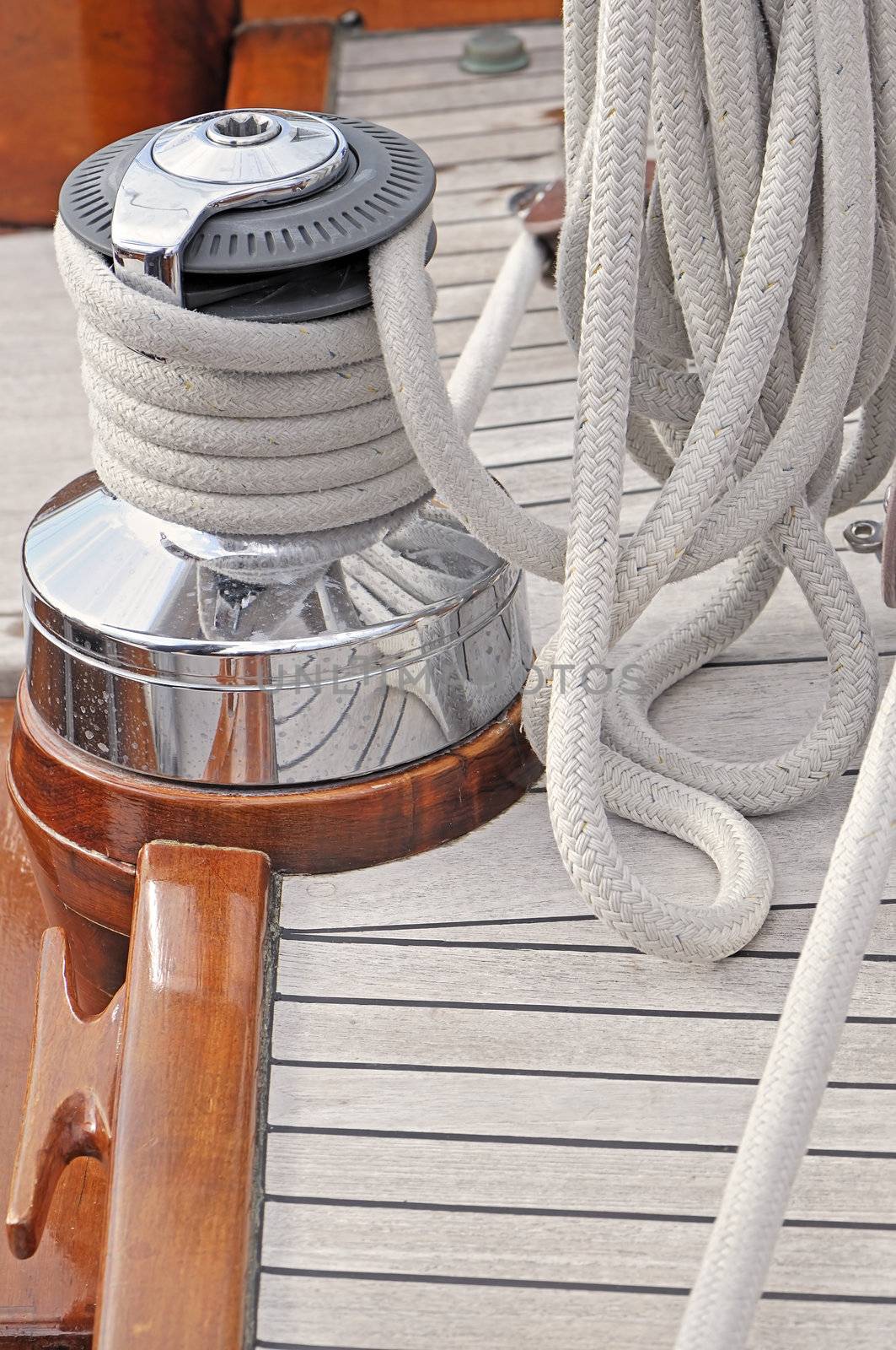 Winch and rope on a wooden sailboat