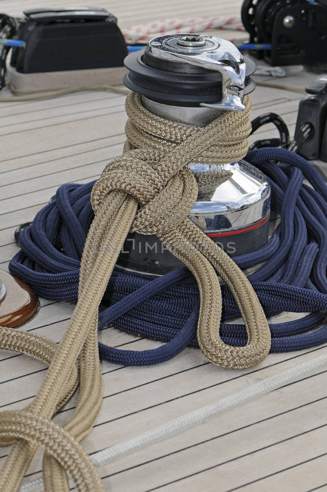 Ropes wrapped on a winch of a sailboat