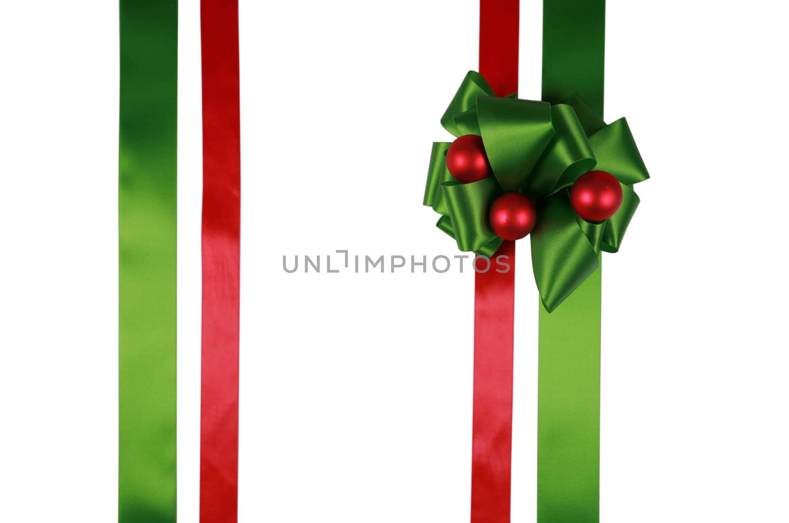 Red and green ribbons with bow, isolated, ready for overlay over a gift box