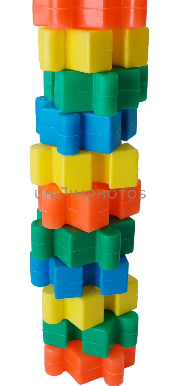 Pyramid built from colored slice puzzle on the white background