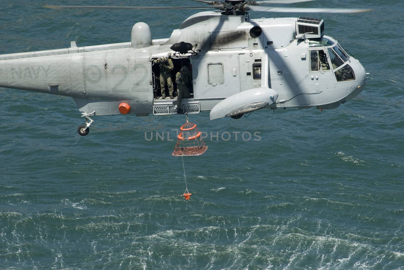 a royal Australian navy rescue helicopter performing a public rescue demonstration for Australia day