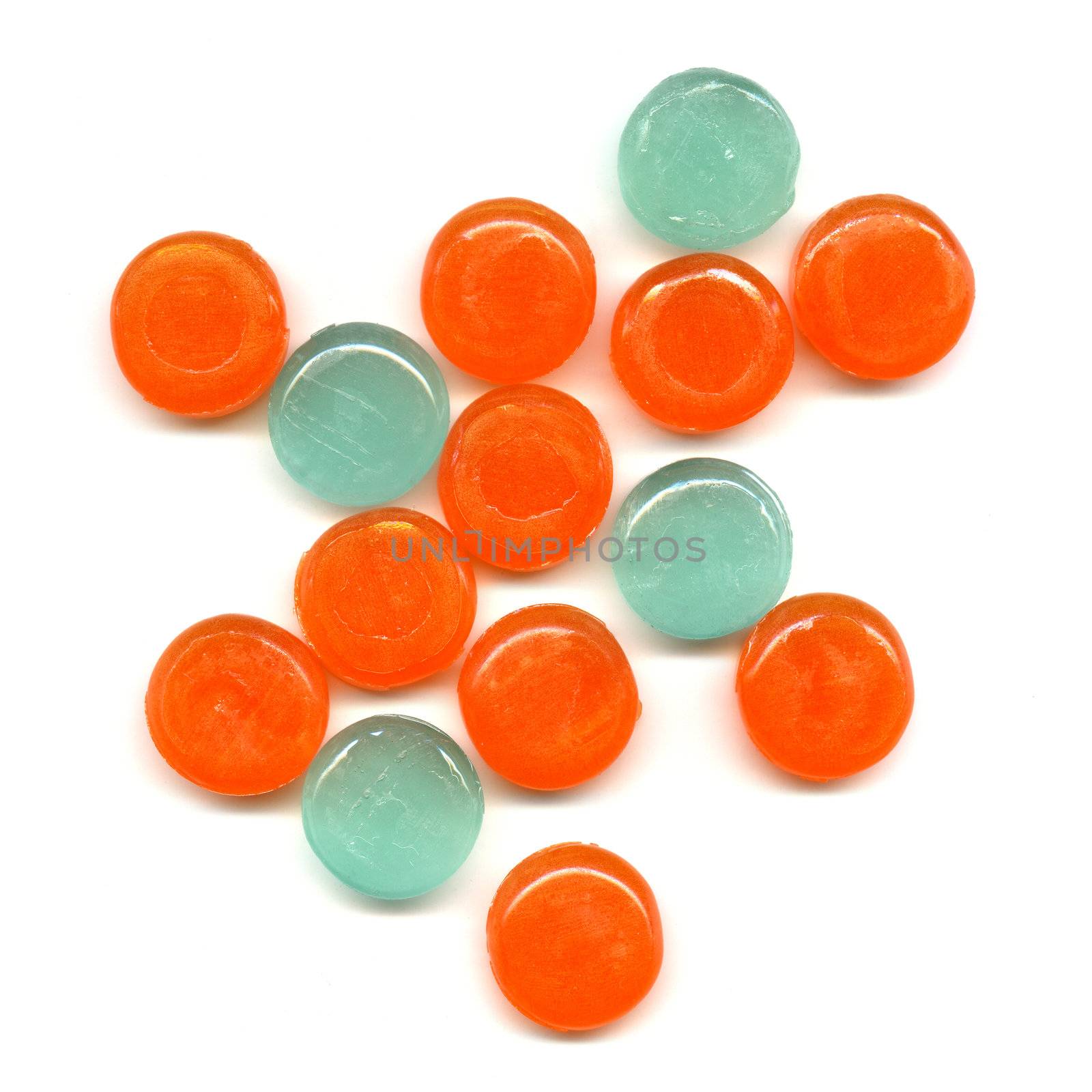 Pile of orange and green transparent tablets