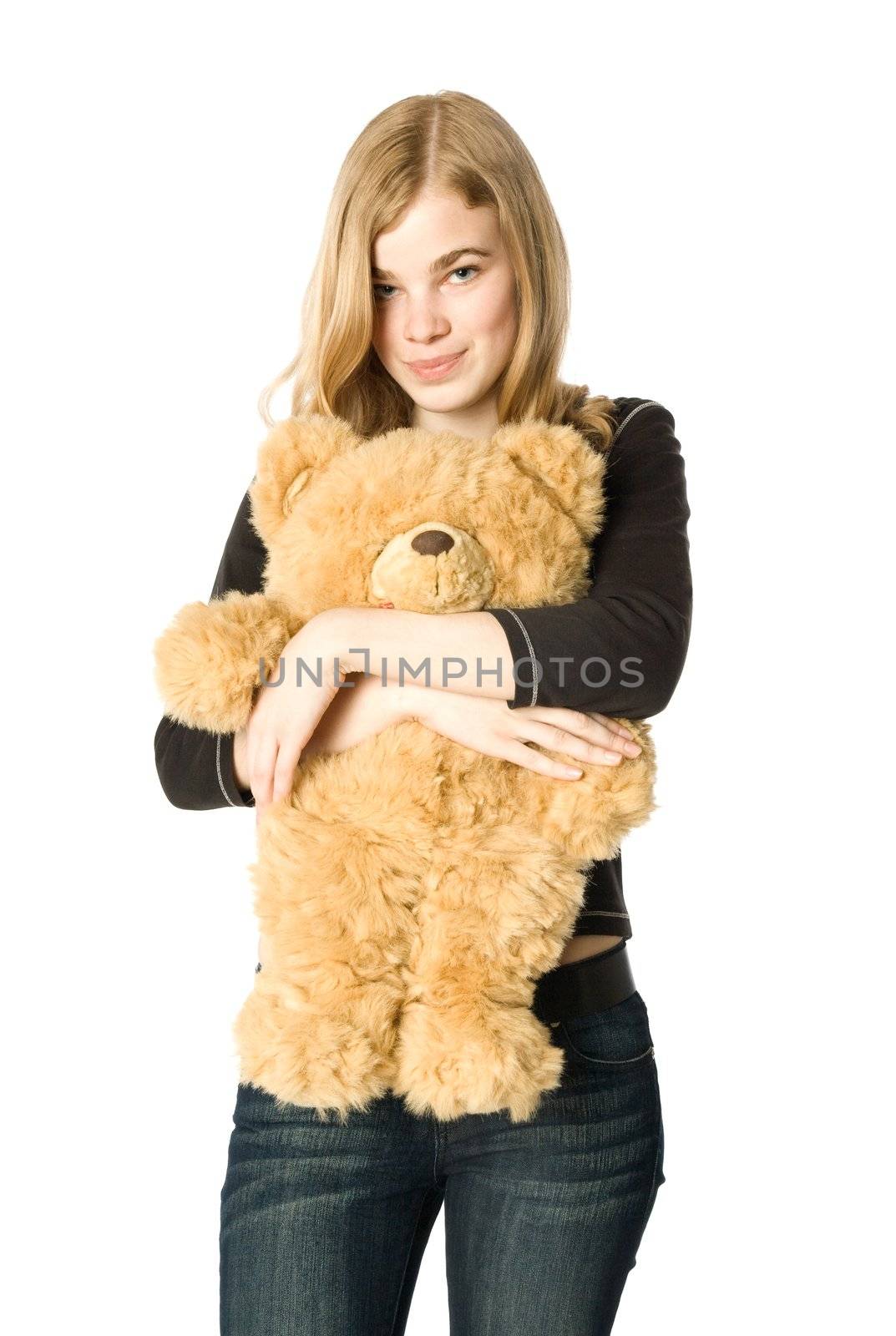 Young girl hugging a teddy bear, isolated