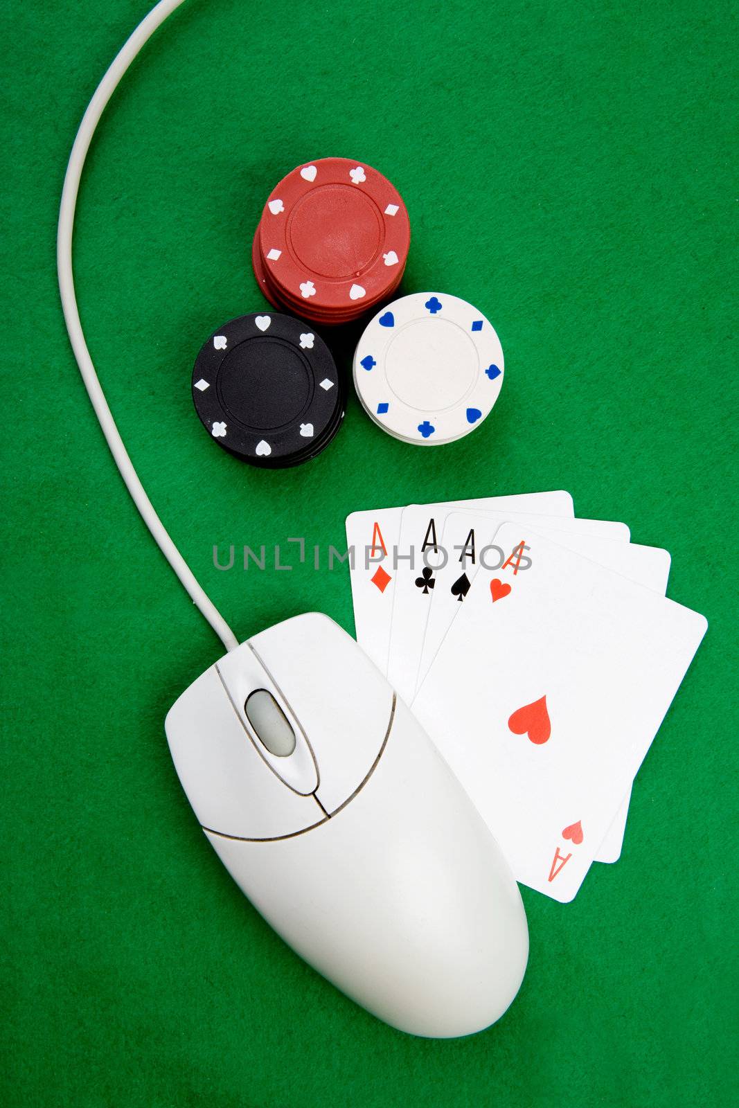 An online gaming concept with computer mouse, four aces and green felt