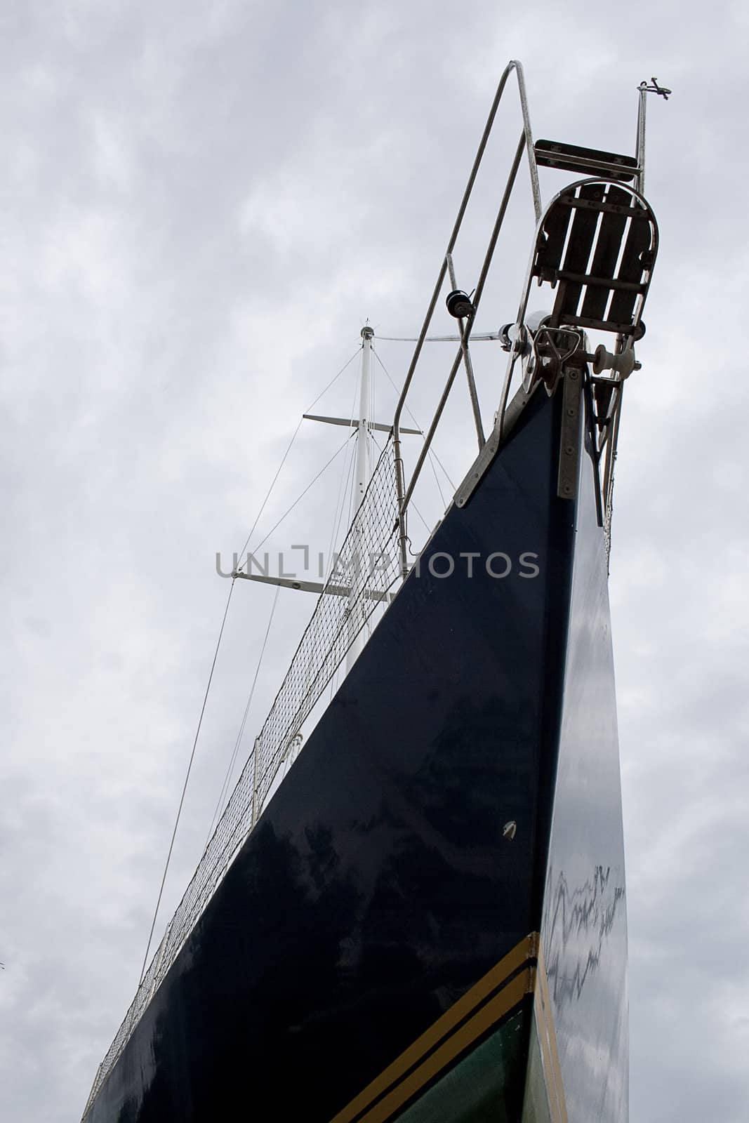 Blue hull sailboat photographed from an original point of wiew