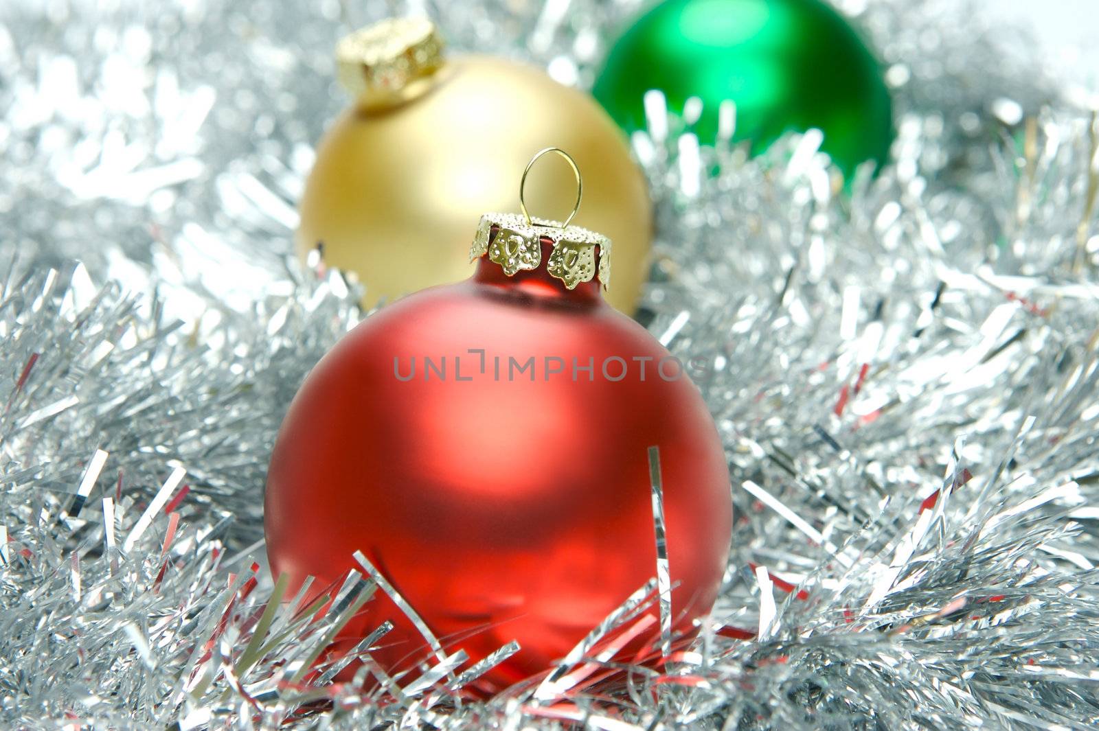 Christmas ornaments isolated on a tinsel