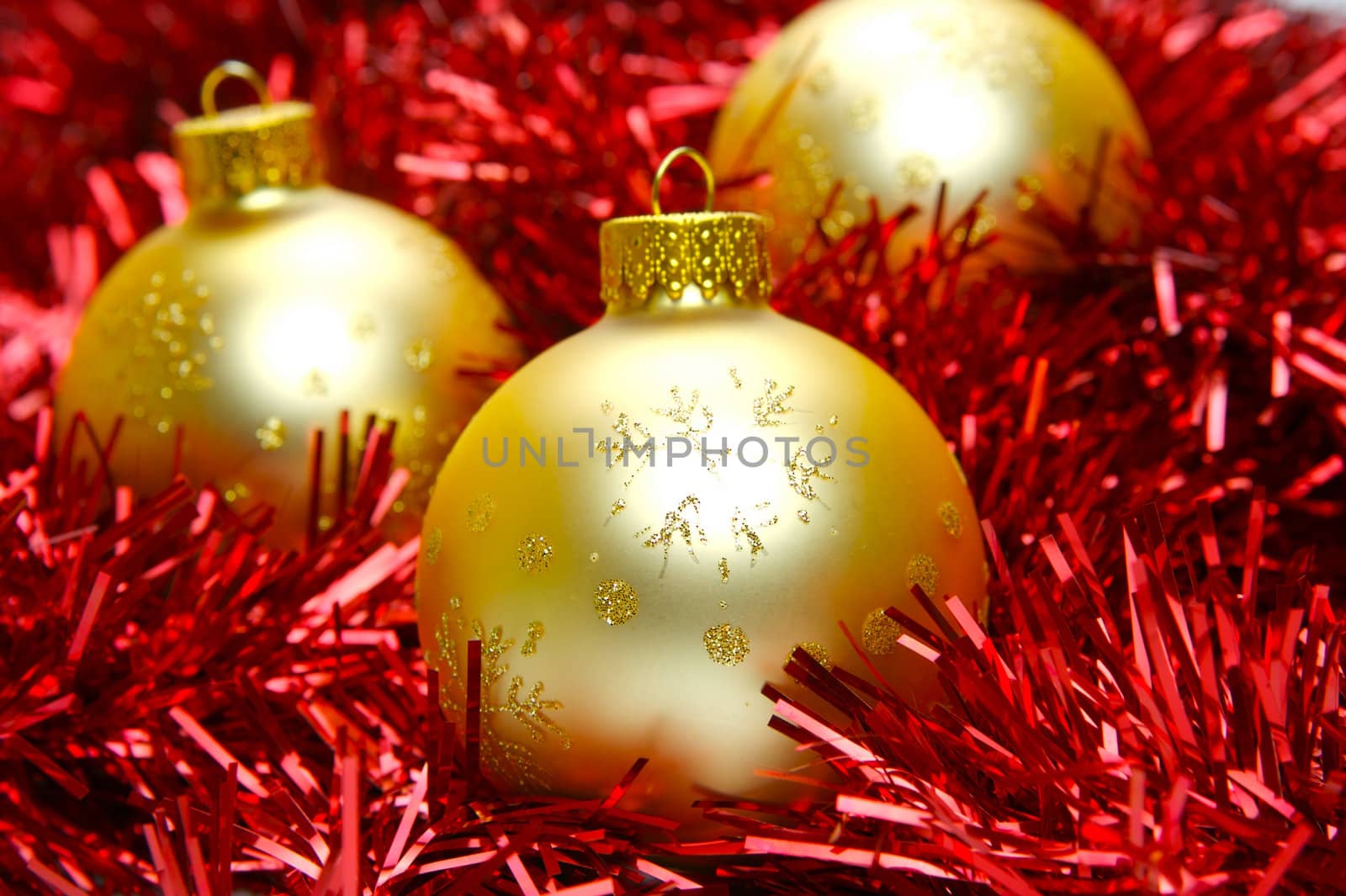 Christmas ornaments isolated on a tinsel