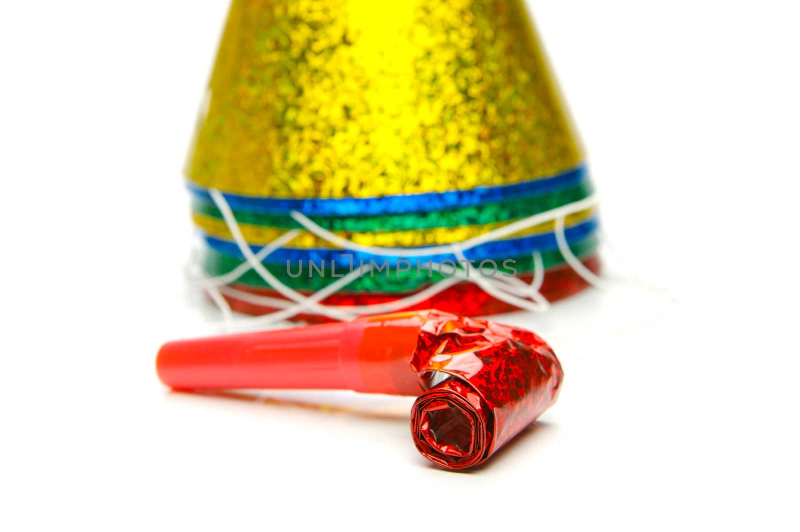 Party hats and blowers isolated against a white background