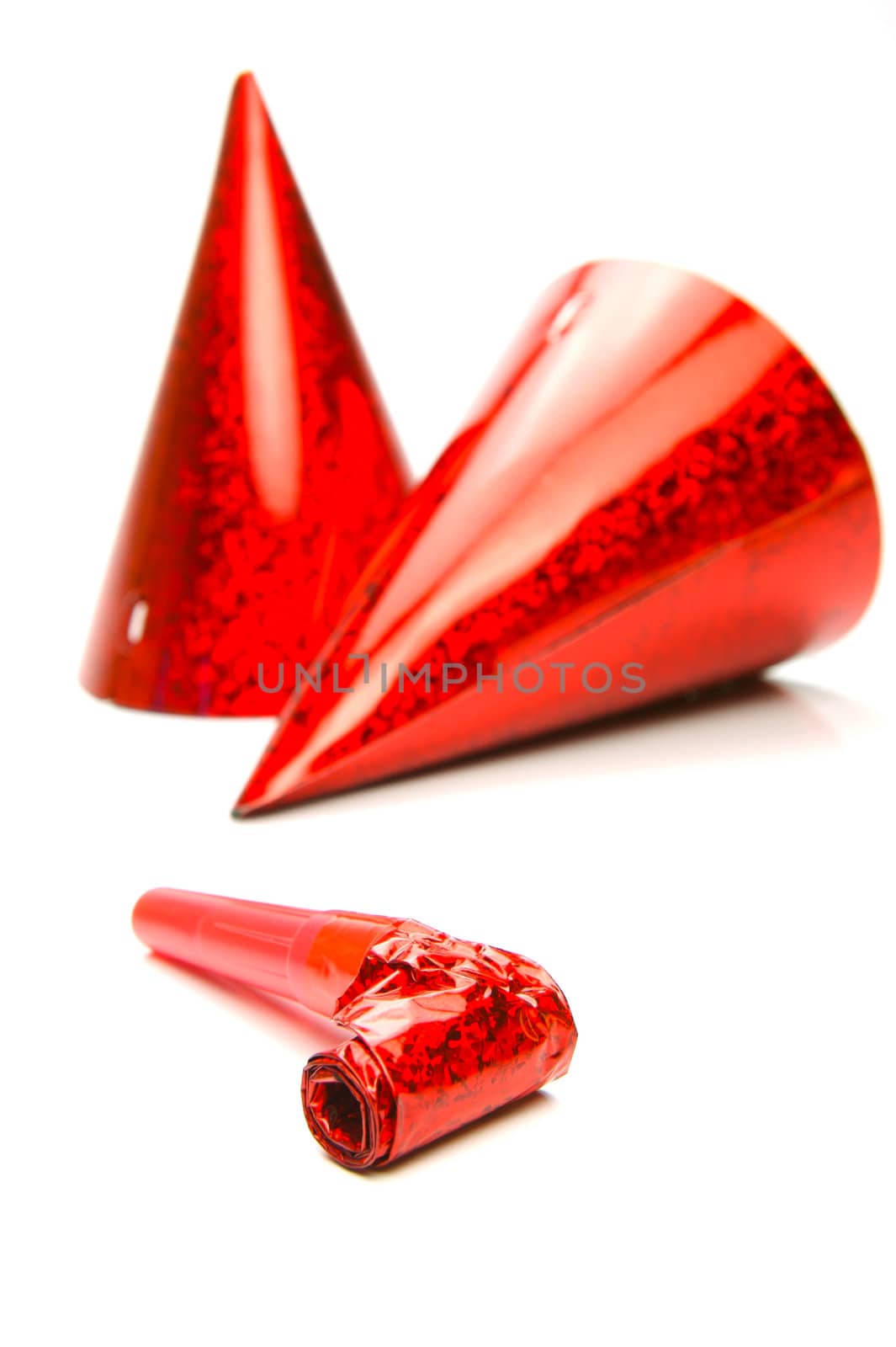 Party hats and blowers isolated against a white background