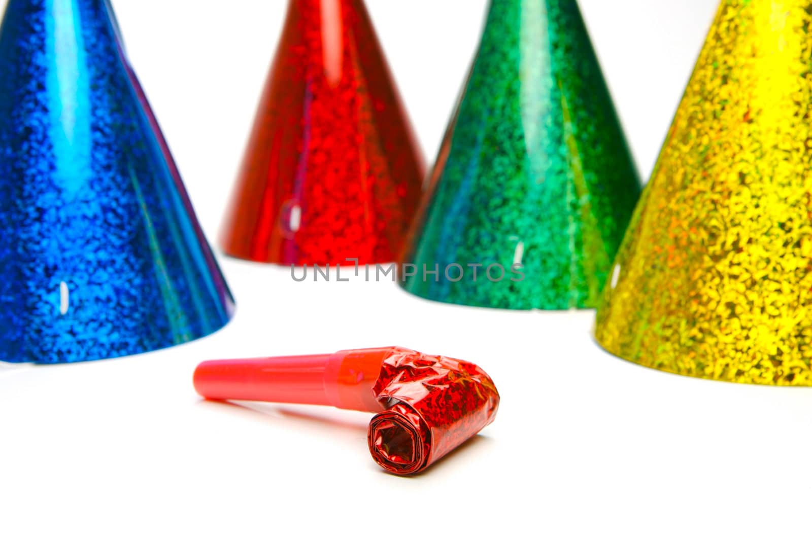 Party hats and blowers isolated against a white background