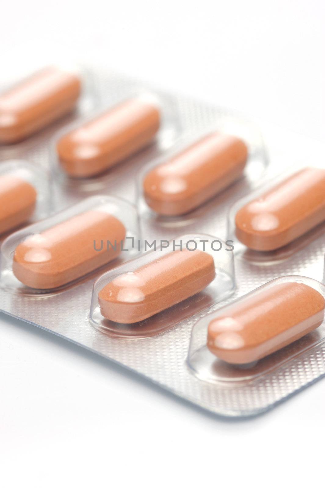 Prescription tablets isolated against a white background