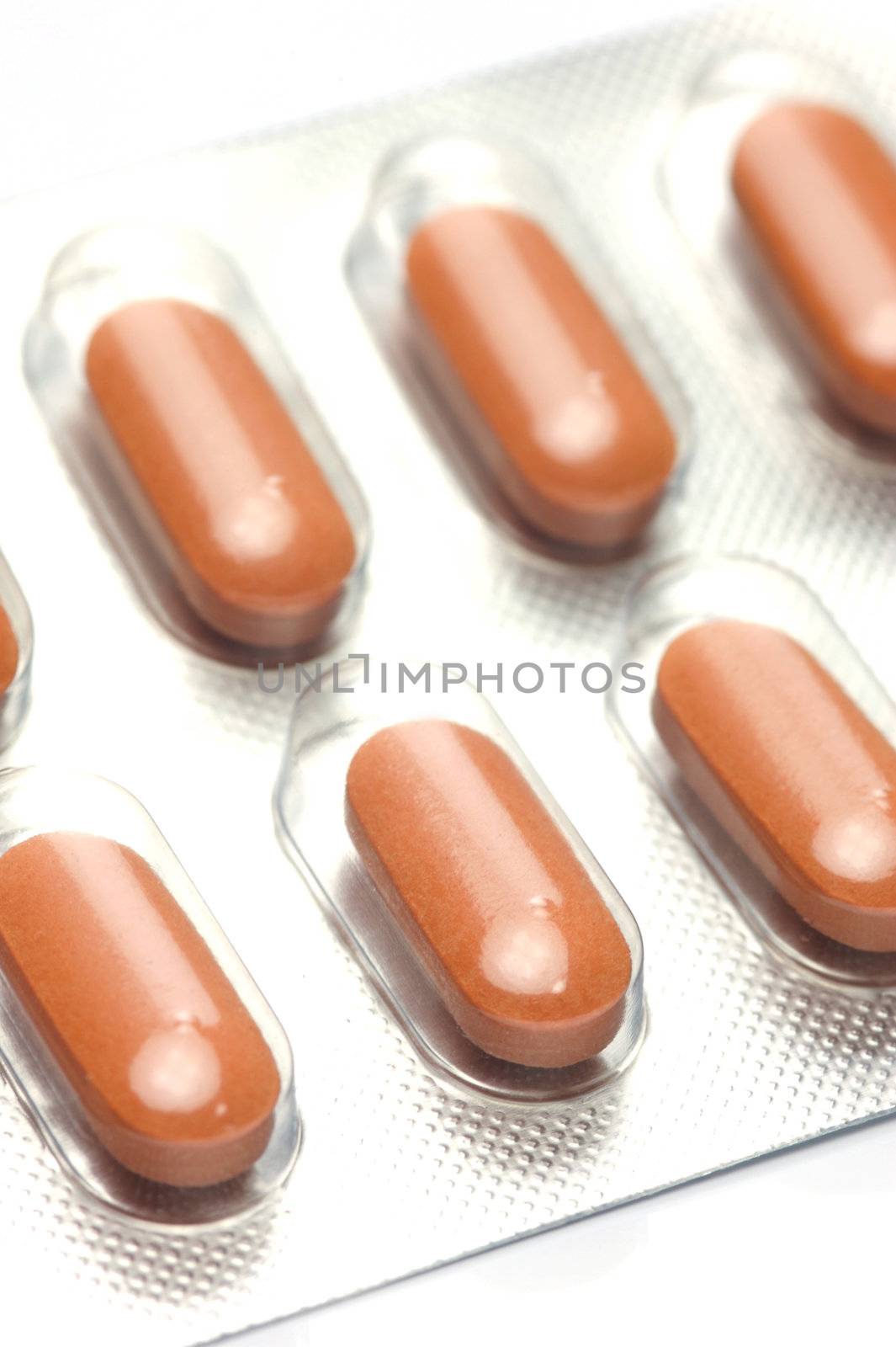 Prescription tablets isolated against a white background