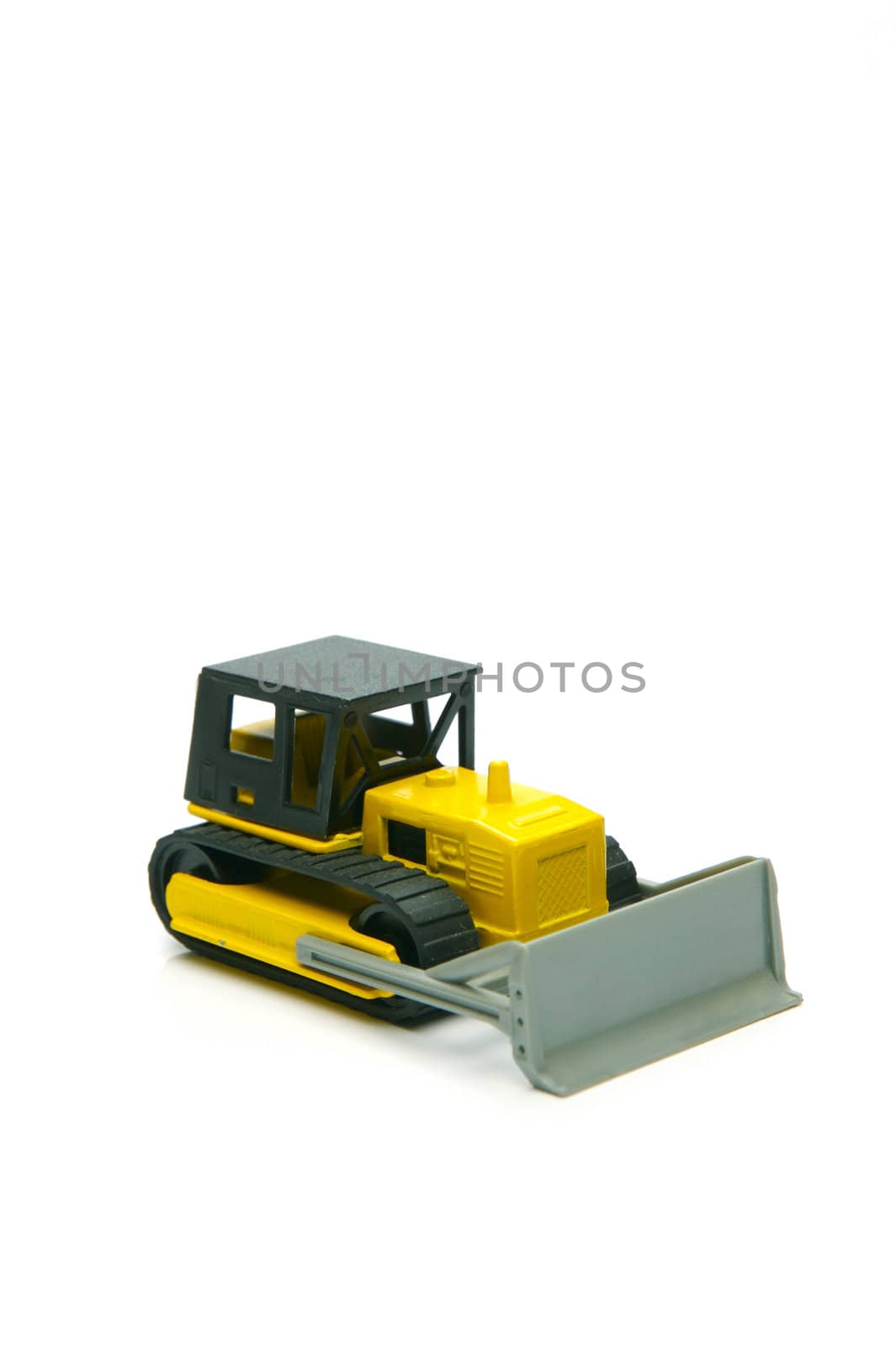 Miniature model earth moving equipment isolated against a white background