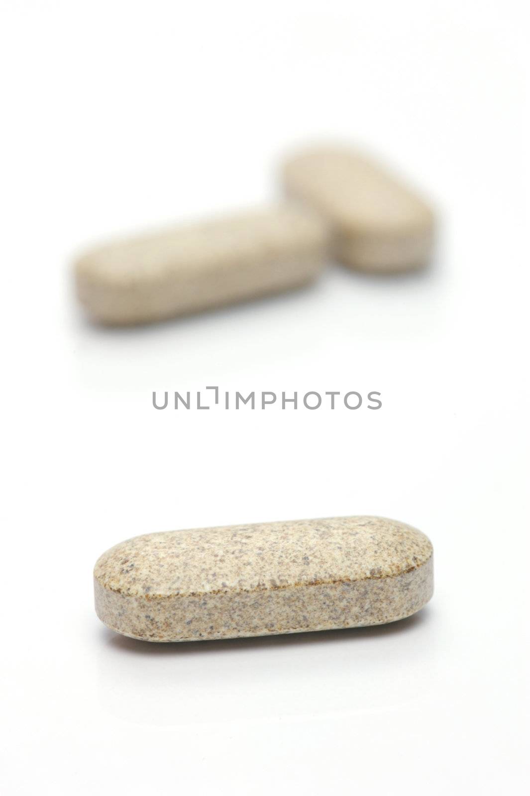 Prescription tablets isolated against a white background