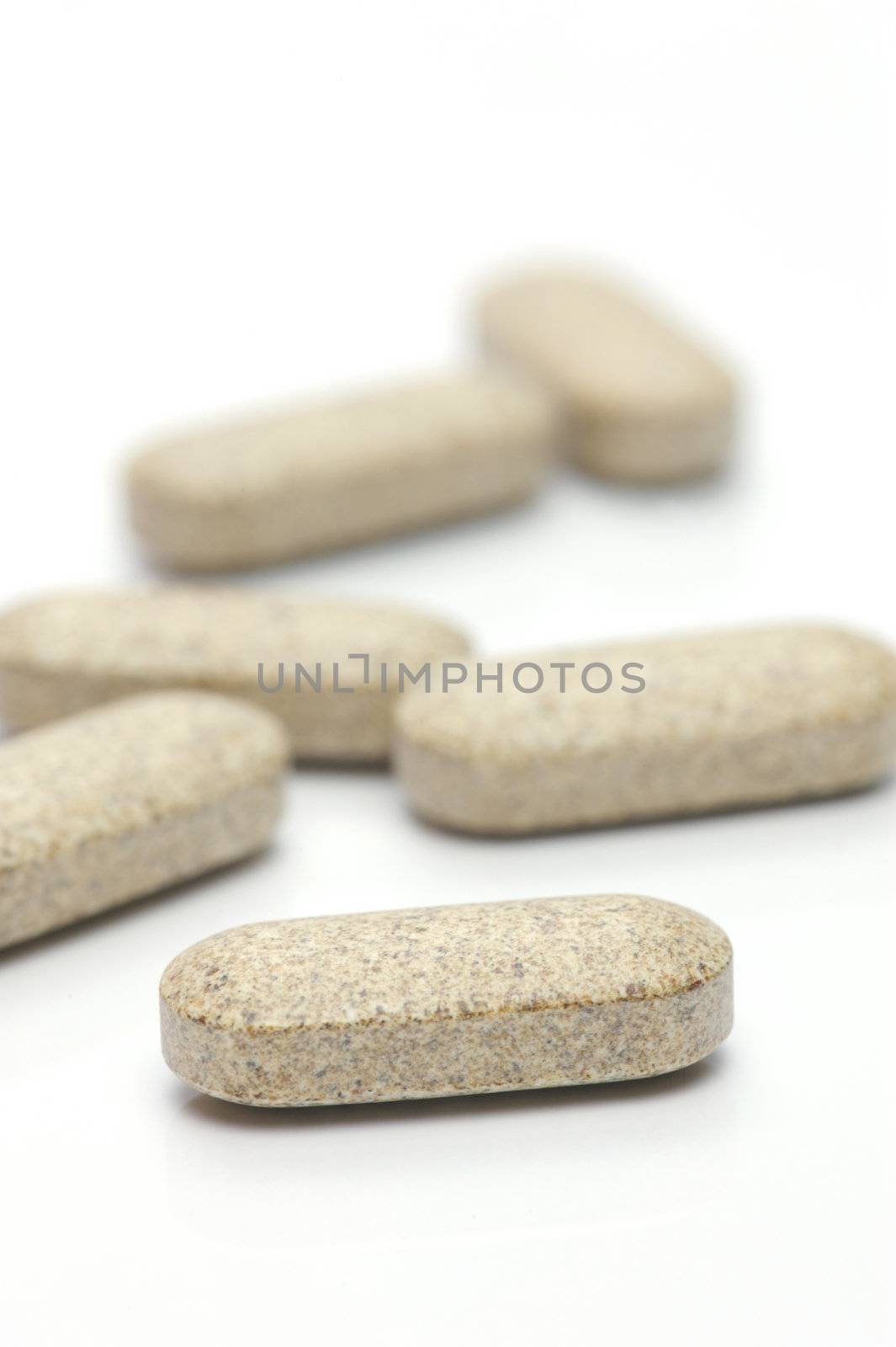 Prescription tablets isolated against a white background