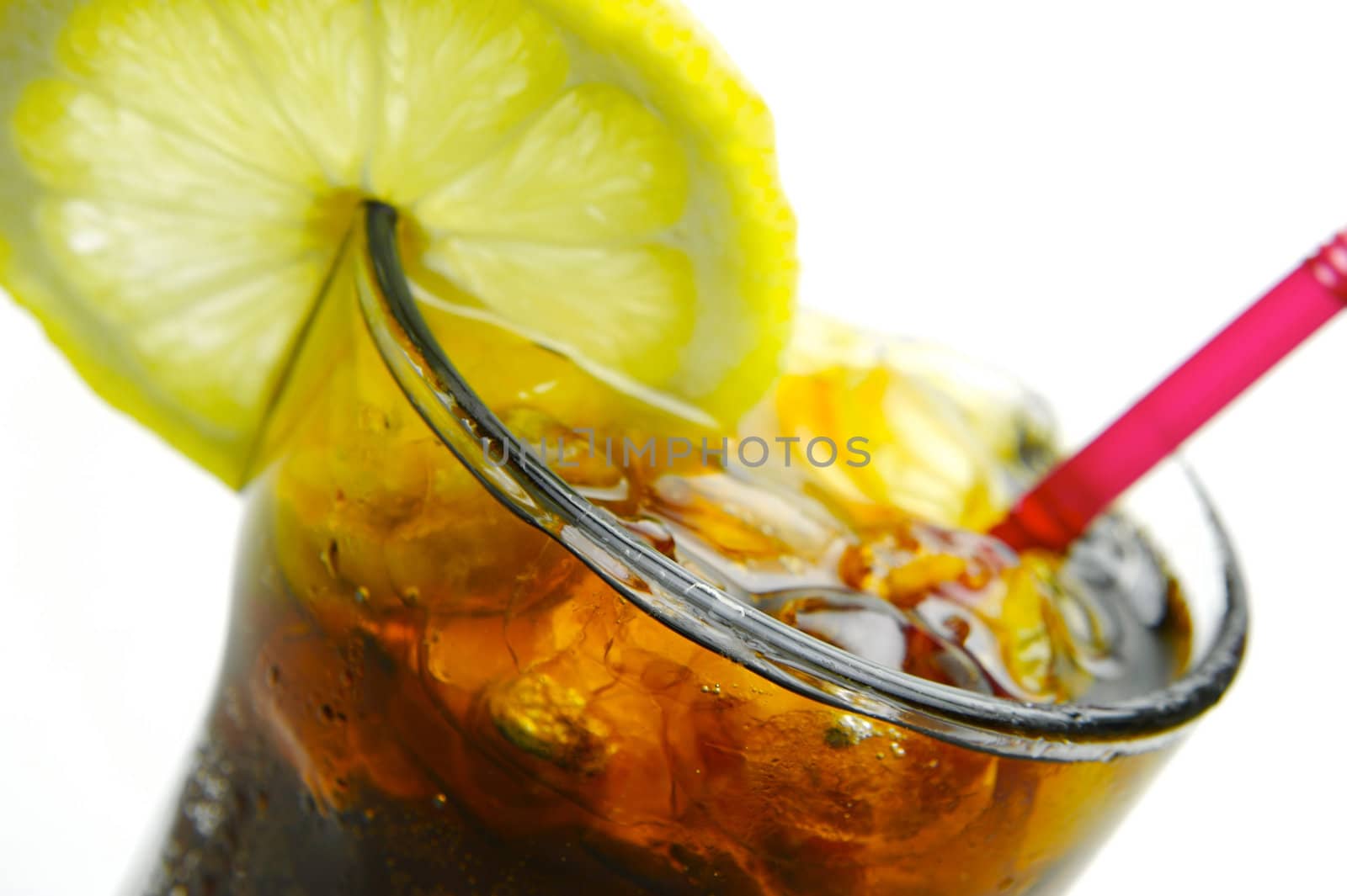 A glass of lemon cola isolated against a white background