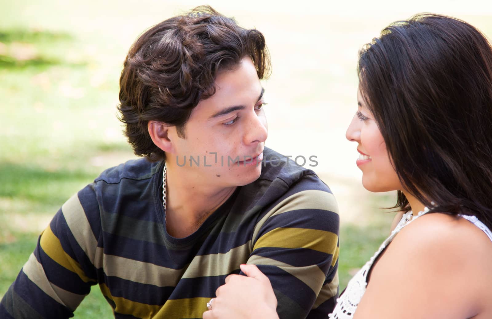 Attractive Hispanic Couple At The Park by Feverpitched