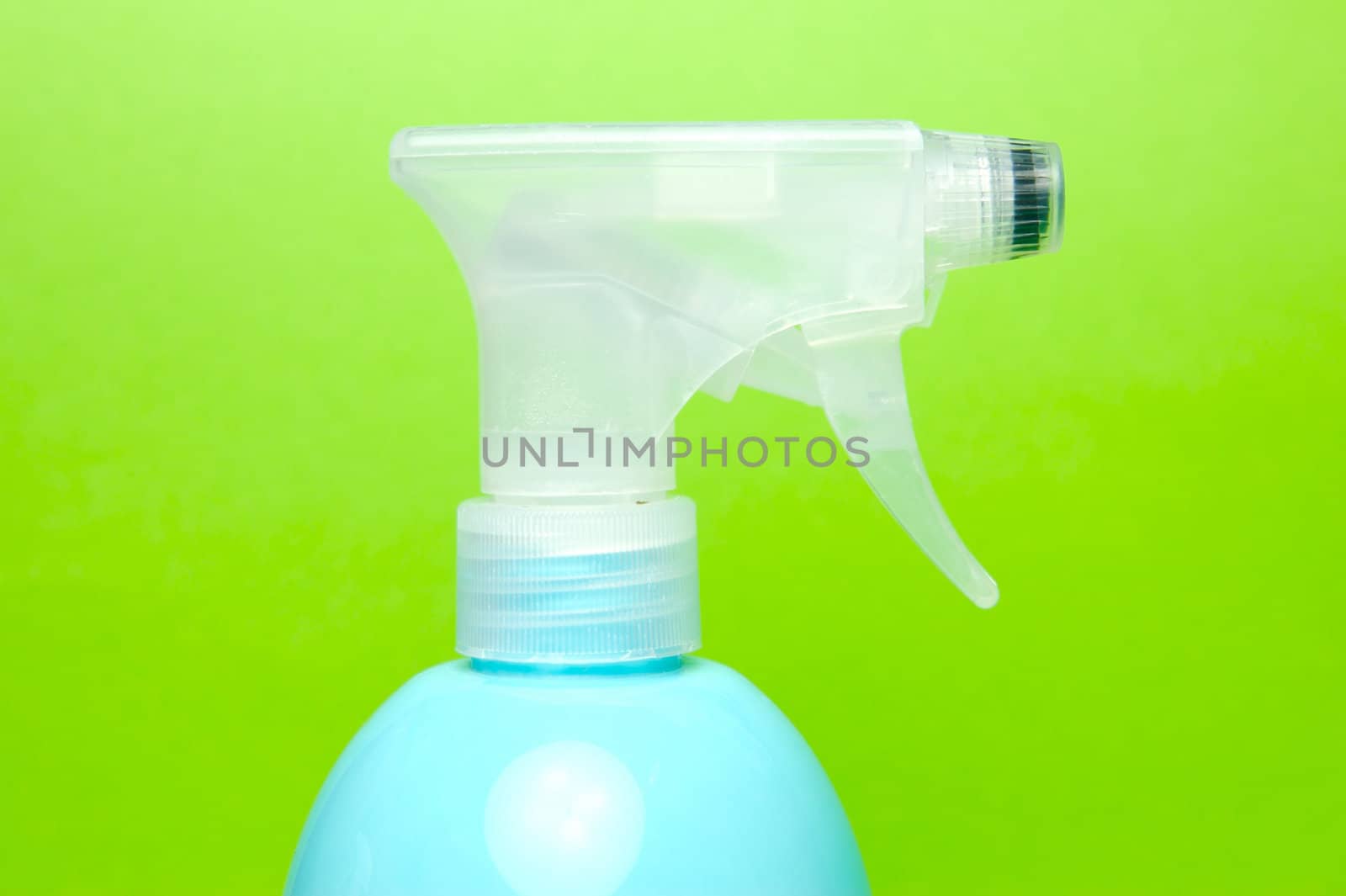 A spray bottle isolated against a blue background