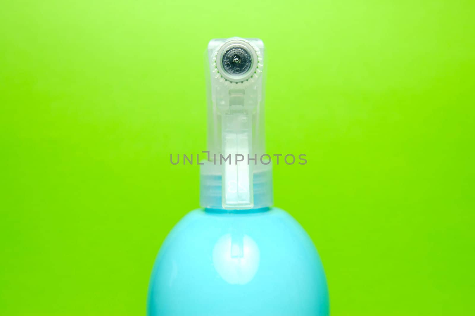 A spray bottle isolated against a blue background
