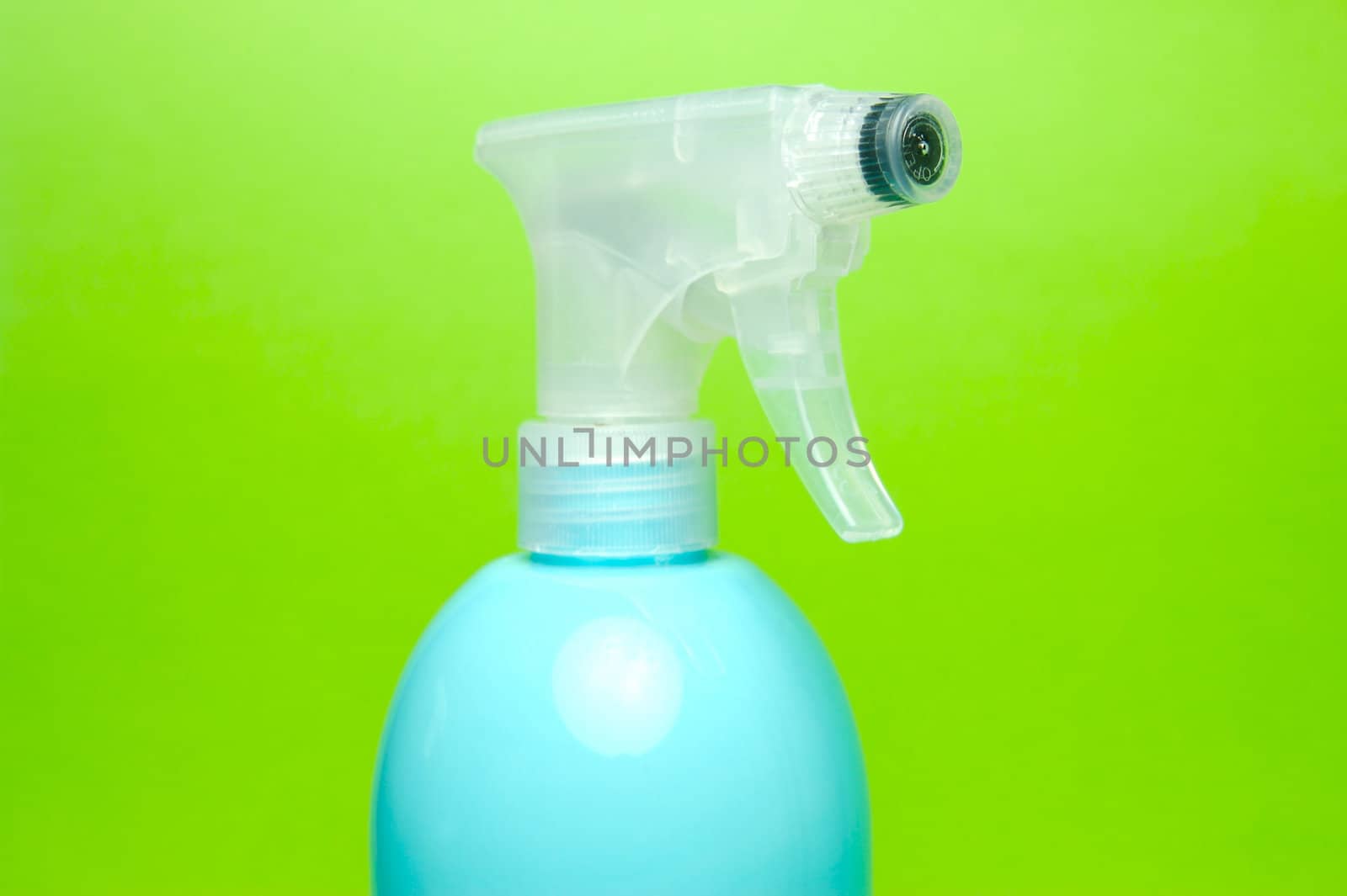 A spray bottle isolated against a blue background