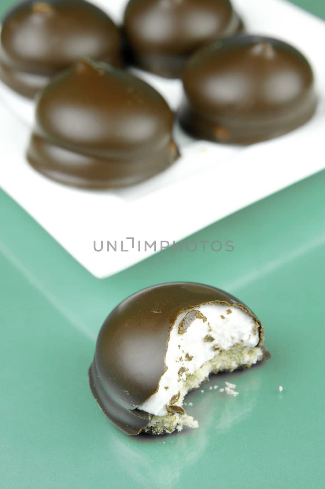 Marshmallow biscuits isolated against a green background