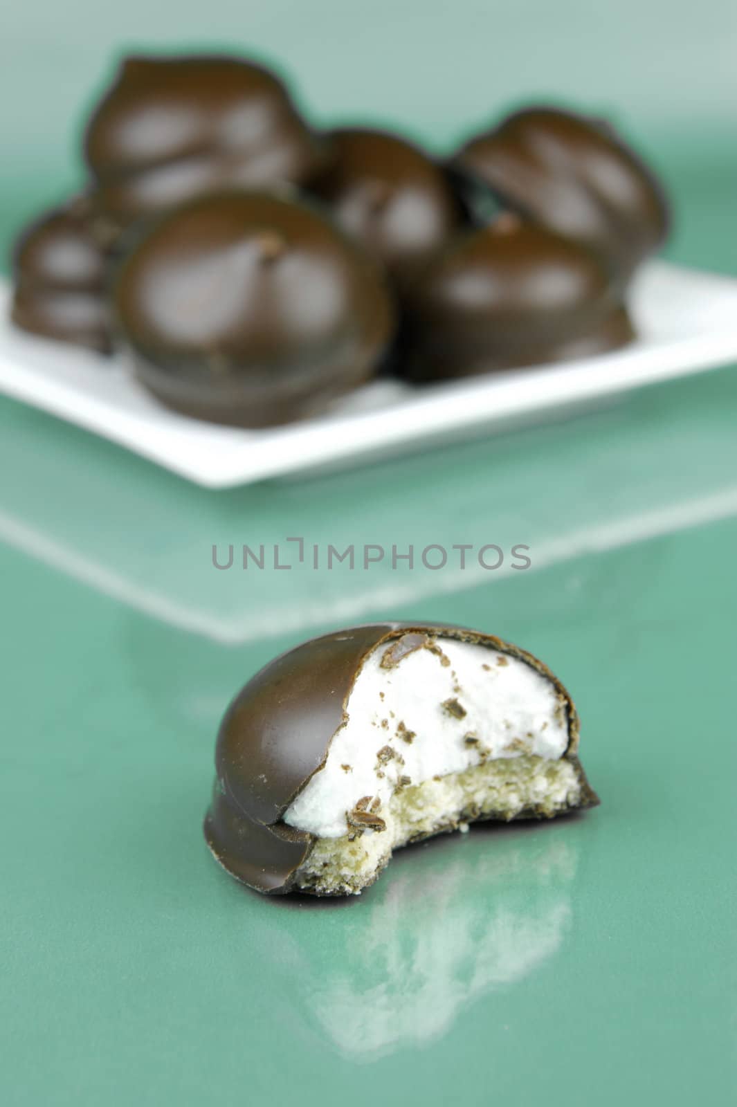 Marshmallow biscuits isolated against a green background