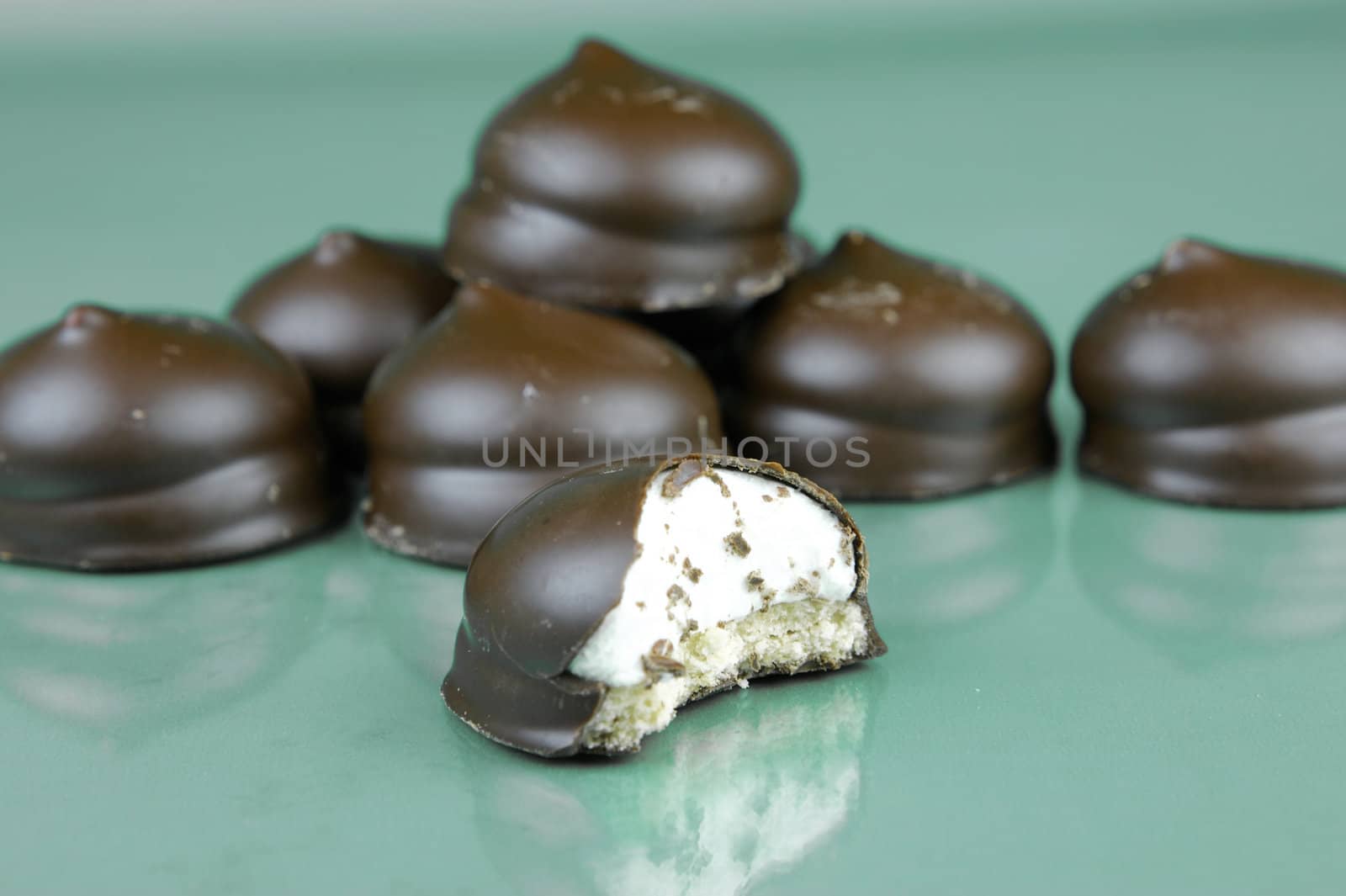 Marshmallow biscuits isolated against a green background