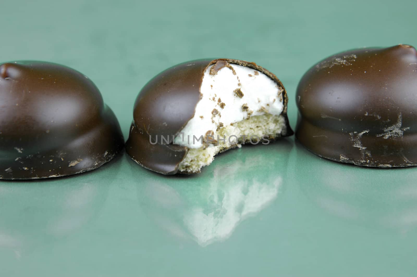 Marshmallow biscuits isolated against a green background