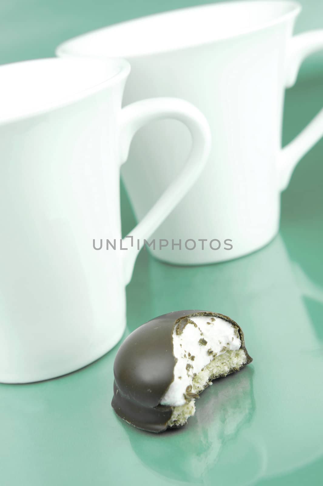 Marshmallow biscuits isolated against a green background