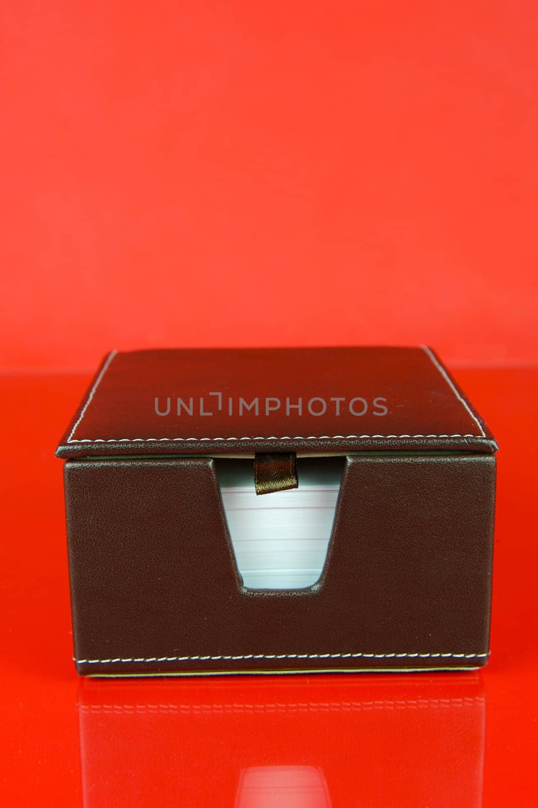 A note block isolated against a red background