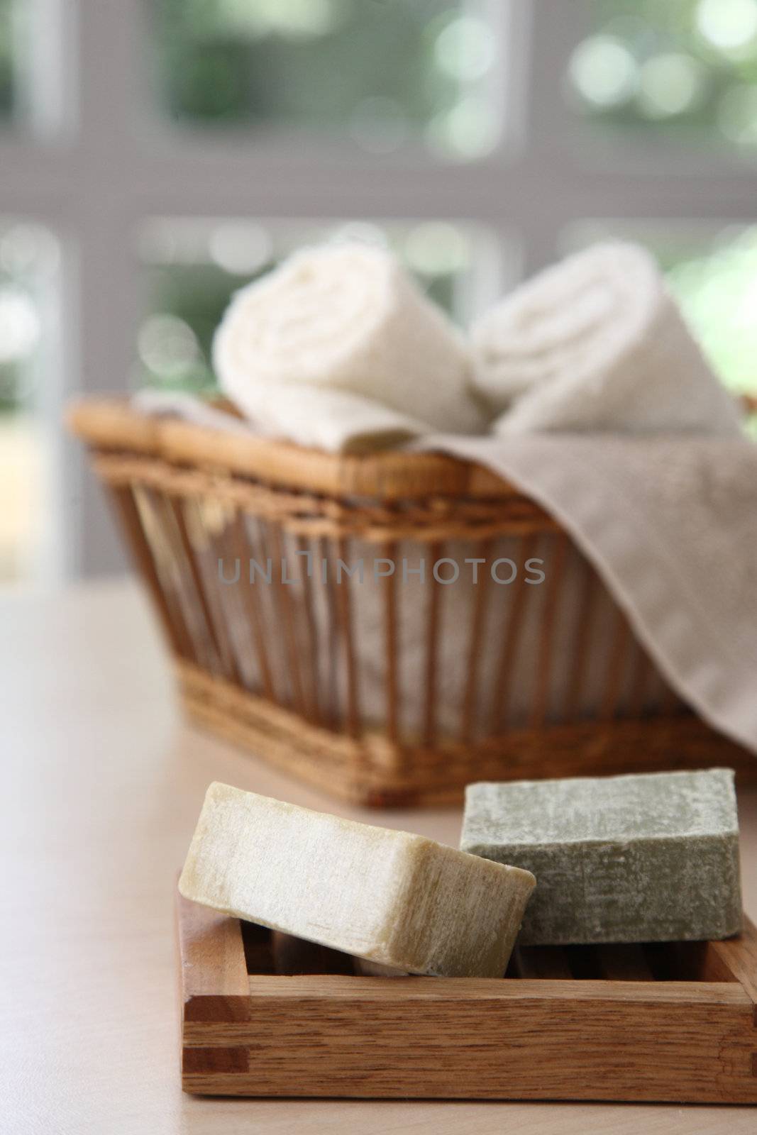 Soaps,towels and basket with a blurred background