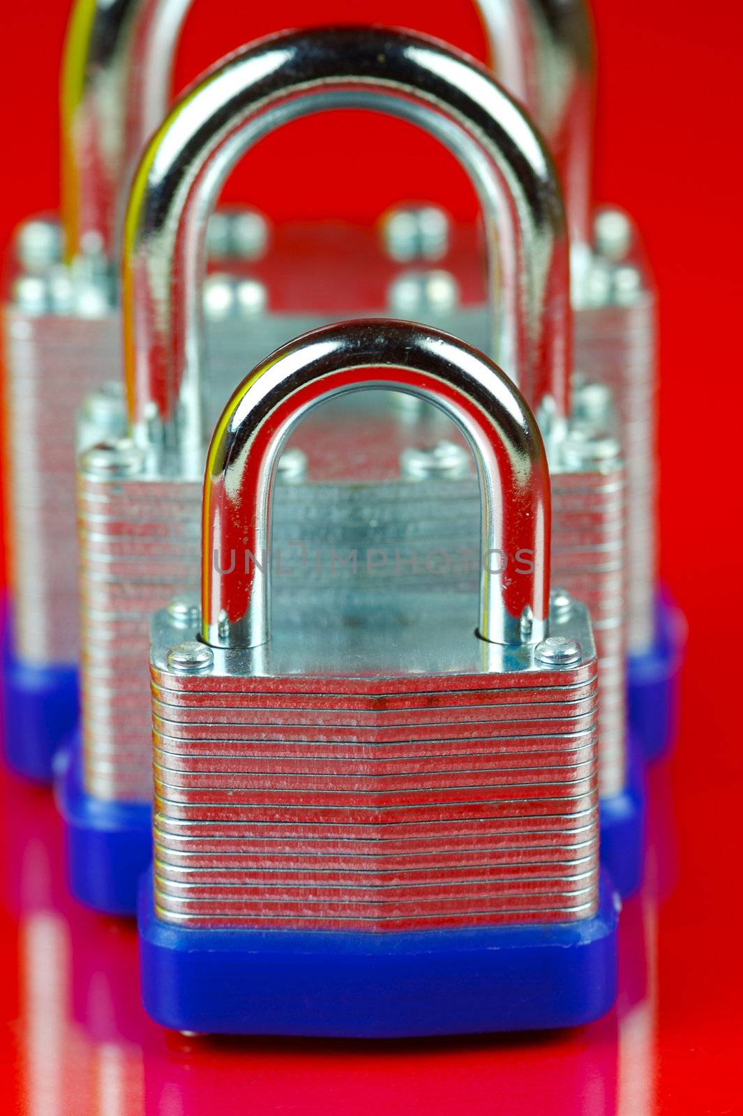 A padlock isolated against a red background