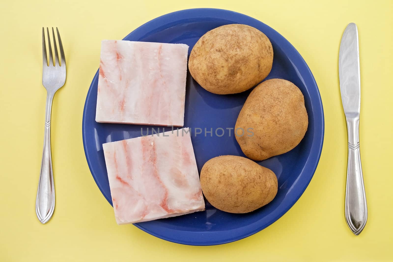 fish fillet and potatoes in jackets 