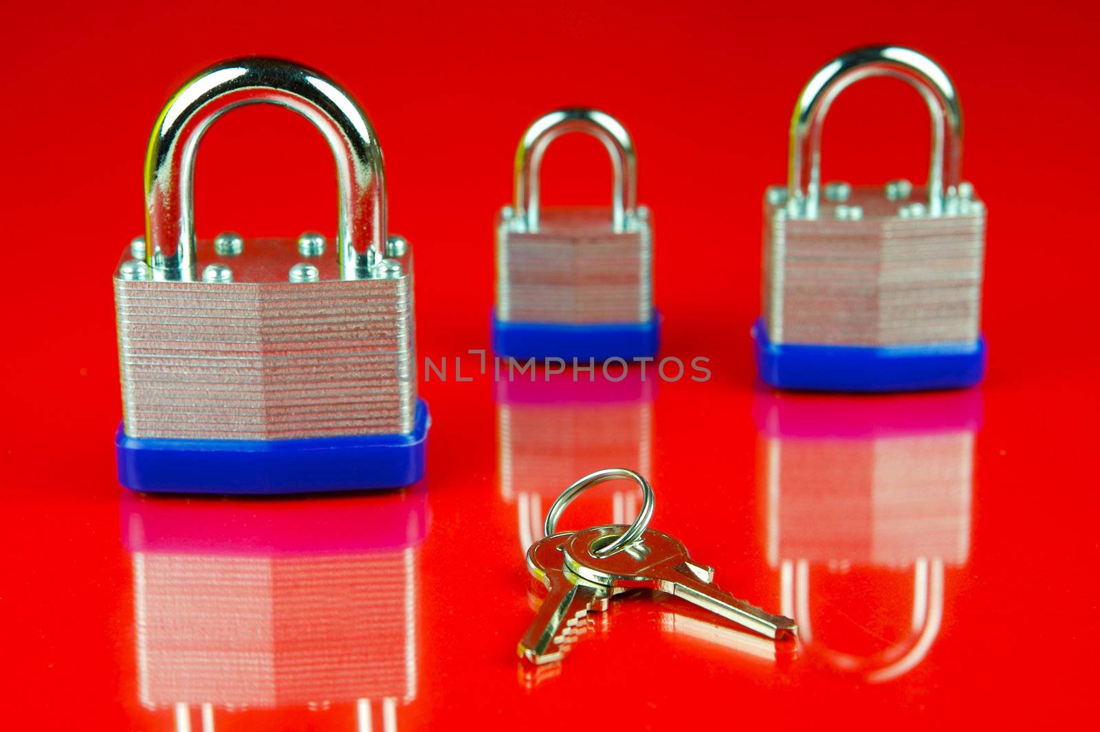 A padlock isolated against a red background