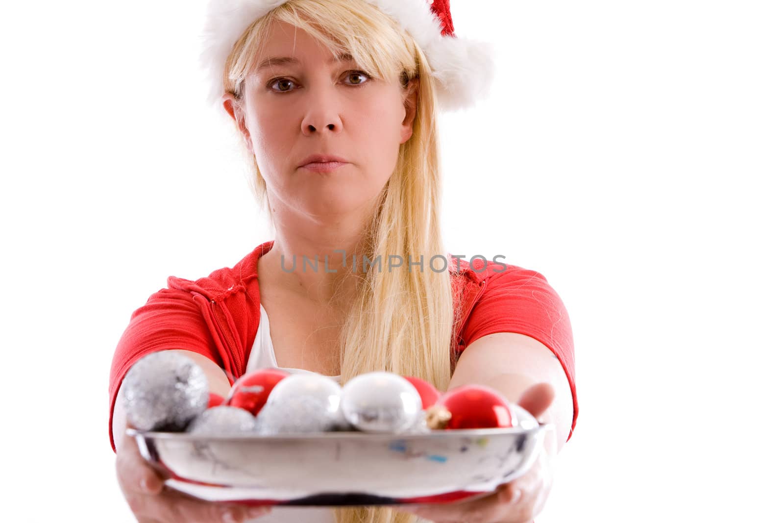 Mature woman with christmas hat handing the baubles over