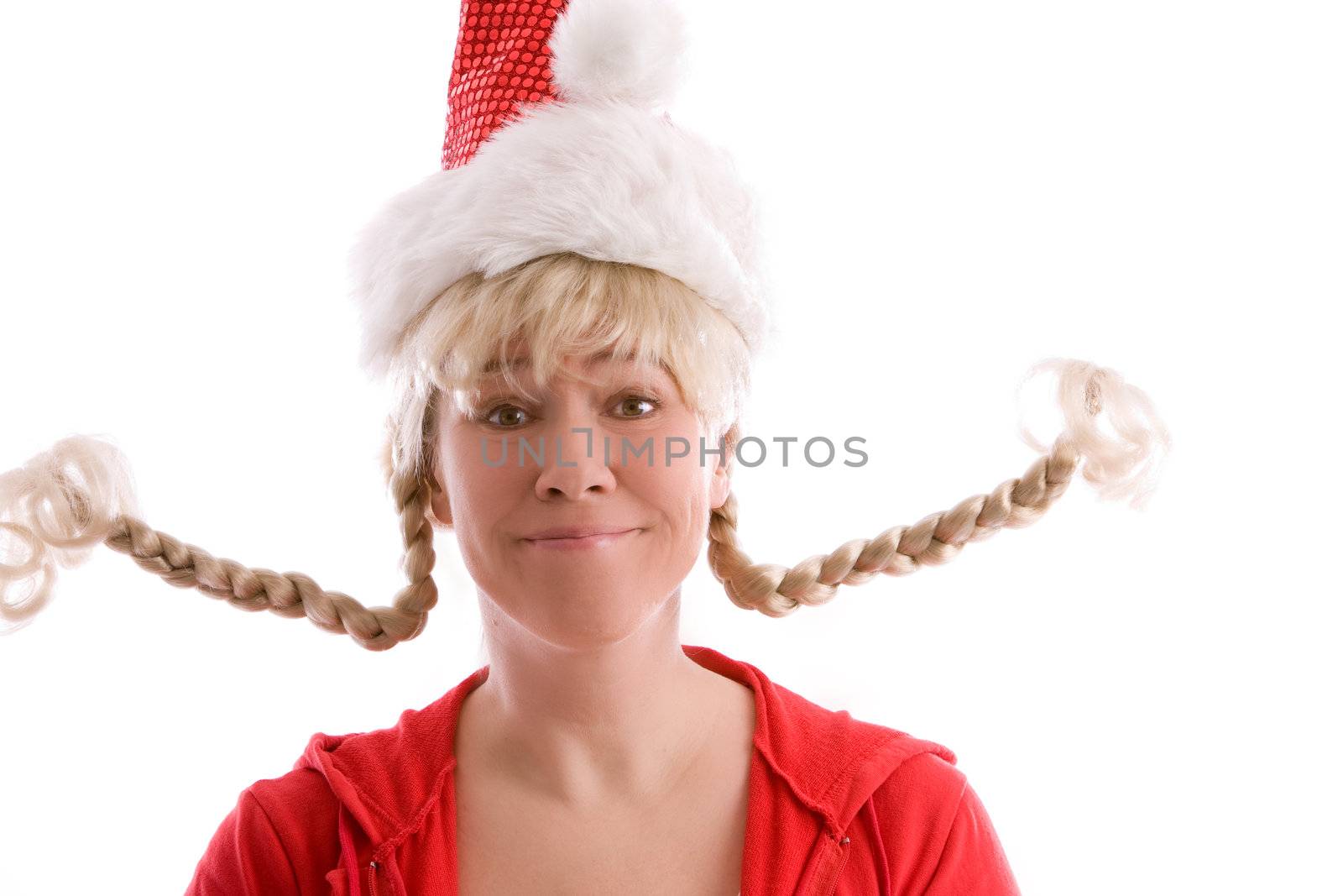 Mature woman with two pigtails standing out and wearing a christmas hat