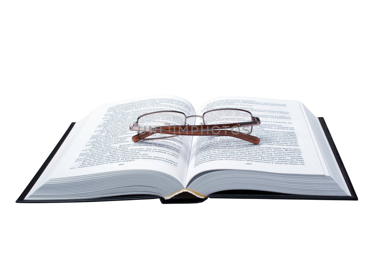 glasses on the opened book by kromeshnik