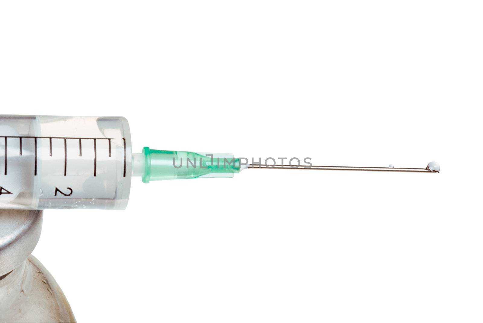 Drop on a tip of a needle of a syringe, it is isolated, on a white background.