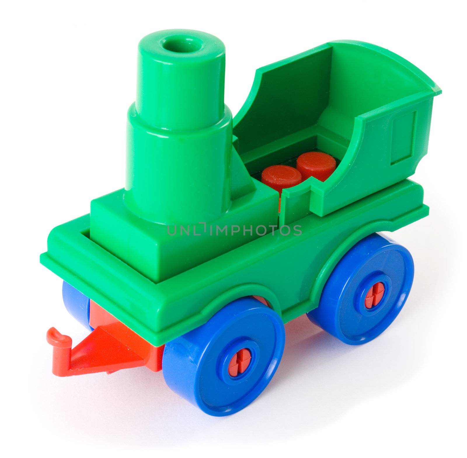 Toy green plastic engine on the white background