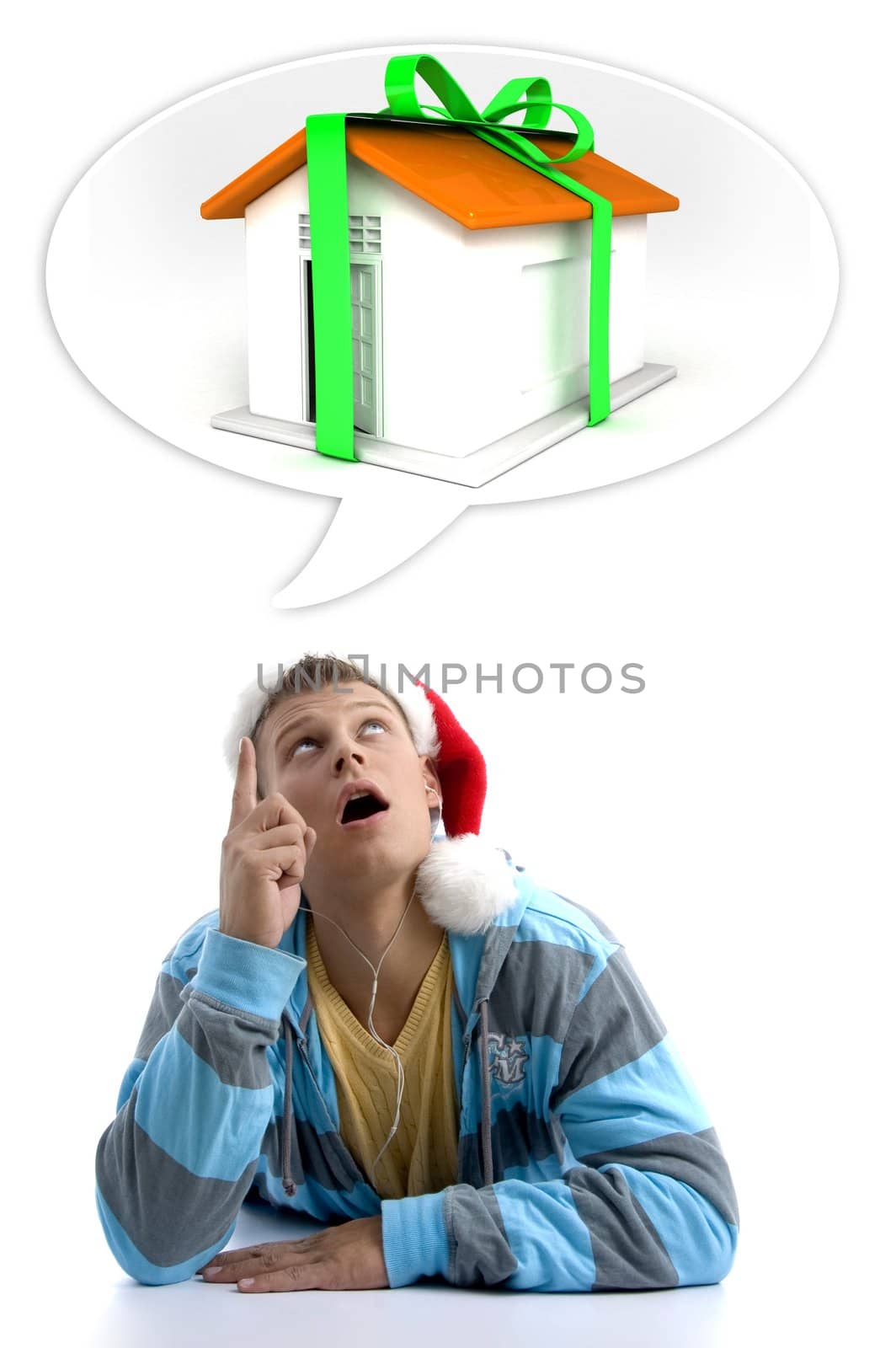 man pointing at three dimensional house and wearing christmas hat on an isolated background